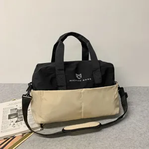 Large capacity travel duffel bag for fitness sports, stylish canvas shoulder handbag.