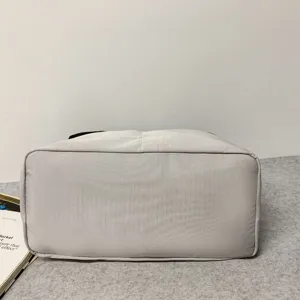 Grey travel duffel bag durable sports gym weekender bag bottom detail showcase for daily use.