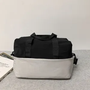 Two-tone travel duffel bag for men and women, durable fitness gym shoulder handbag.