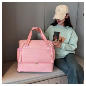 Pink travel duffel bag for gym and fitness, large capacity portable weekend luggage bag.