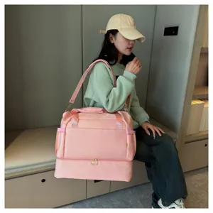 Large capacity pink travel duffel bag with bottom compartment fitness shoulder bag for women.