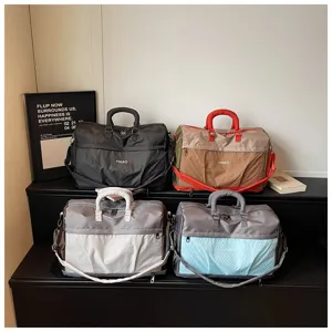 Detailed view of large capacity travel duffel bags in various color combos with front mesh pockets.