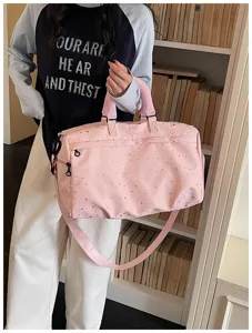 Large capacity pink star print travel duffel bag with shoulder strap for sports and fitness.