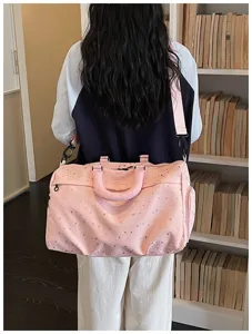 Large pink travel duffel bag with star print, casual shoulder gym bag for men and women.