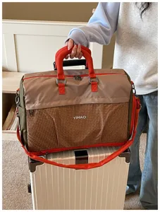 Large capacity travel duffel bag for women and men, short trip portable luggage cabin bag.