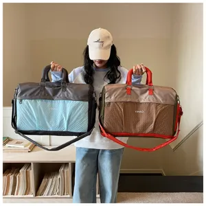 Large capacity travel duffel bag for business trips, gym, and flight carry-on use.