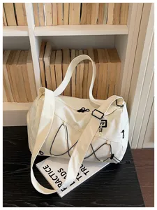 Large capacity canvas duffel travel bag with trolley sleeve, ideal for gym, yoga, and outdoor sports.