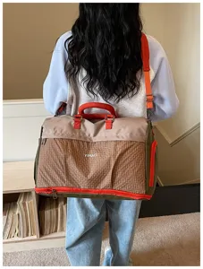 Large capacity travel duffel bag with shoulder strap for weekend trips and fitness sports.