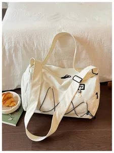 Large capacity canvas travel bag gym bag with shoulder strap and stylish outdoor design details.