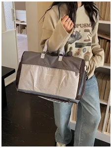 Large capacity travel duffel bag with shoe compartment, stylish portable luggage bag for gym.