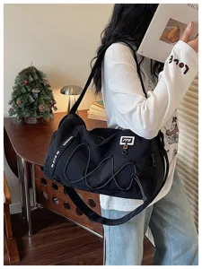 Large capacity travel duffel bag with bungee cords, casual sports fitness shoulder bag for trips.
