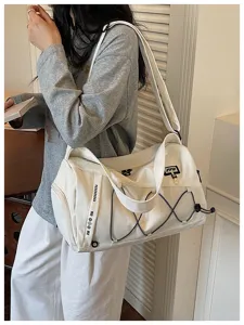 Large capacity canvas travel duffel bag for gym, fitness and outdoor sports with shoulder strap.