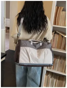 Large capacity travel duffel bag with shoe compartment, stylish shoulder gym bag for women.