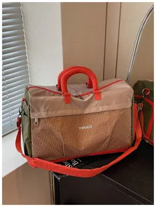 Large capacity travel duffle bag with shoe compartment, ideal for gym, sports, and weekend trips.