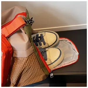 Large capacity travel duffel bag with separate shoe compartment for fitness gym and weekend trips.