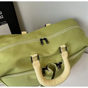 Large capacity solid color travel duffel bag detail, lightweight waterproof fabric, stylish.