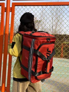 Large capacity red travel backpack, casual waterproof sports fitness luggage bag for men women.