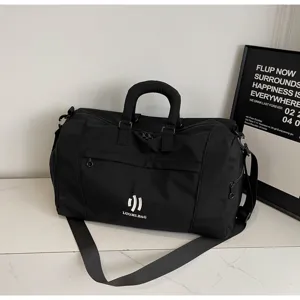 Detailed view of black travel duffel bag showing durable fabric, sturdy handles and smooth zippers.