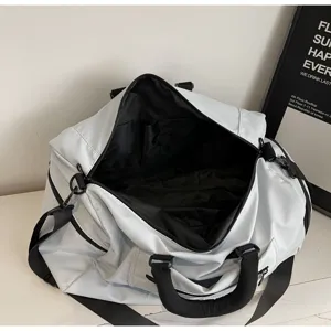 Large capacity solid color travel duffel bag, lightweight portable design with interior compartments.