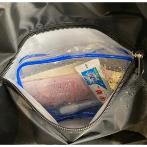 Waterproof travel duffel bag interior detail, large capacity storage for toiletries and gear.