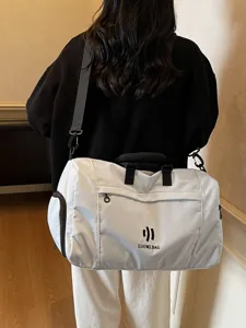 Large capacity travel duffel bag with shoulder strap for sports, fitness and business.