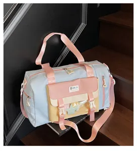 Sweet pastel color block travel duffel bag with clear front pocket and shoulder strap.