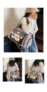 Detail view of sweet color-block travel duffel bag, large capacity ita bag with clear window.