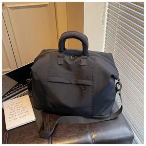 Travel duffle bag detail, casual cotton handbag for commuting, fitness, and gym use.