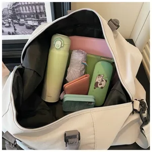 Interior detail view of the travel duffel bag showing spacious capacity and organized daily storage.