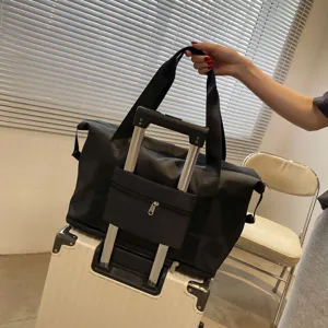 Sac de voyage imperméable noir grande capacité avec sangle de trolley pour le sport et loisirs