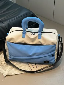 Color-block travel duffel bag, stylish commuter shoulder bag for gym and short trips.