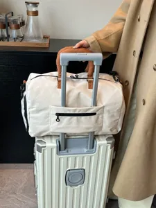 Contrast color travel duffel bag, soft weekender bag with trolley sleeve for trips.