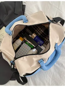Large capacity color block travel duffel bag with shoulder strap for weekend trips.