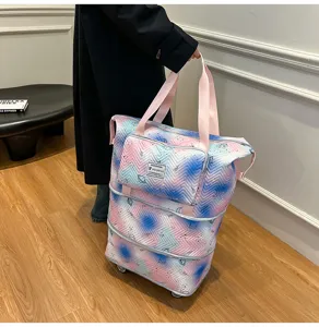 Expandable travel tote bag with universal wheels, large capacity printed luggage for women.