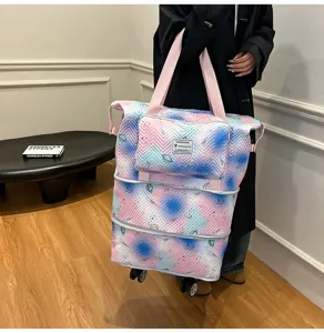 Expandable rolling travel duffel bag with wheels, large capacity printed luggage tote for women.