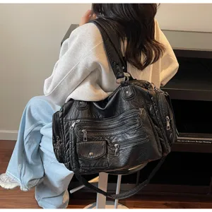 Vintage distressed motorcycle shoulder crossbody bag with multiple zippers and large capacity.