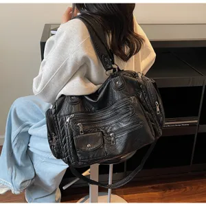 Vintage black motorcycle shoulder bag with multi zippers and spacious capacity for daily wear.