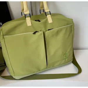 Casual solid color travel duffel bag with dual front zipper pockets and comfortable handles.