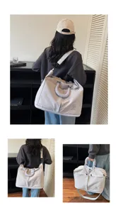 Detailed view of large capacity travel duffel bag with shoulder strap and convenient handles.
