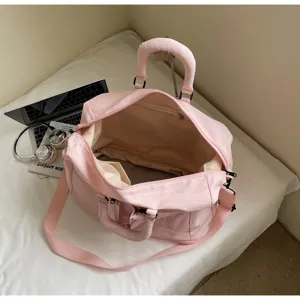Pink travel duffel bag large capacity gym shoulder bag for women and men daily use.