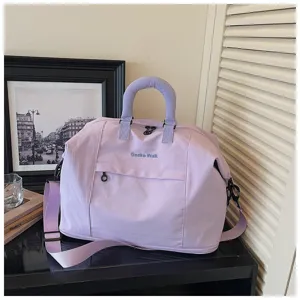 Light purple travel duffel bag with shoulder strap, stylish gym and commuter handbag.