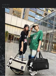Versatile travel duffel bag with shoulder strap and cute pendant for short trips and business.