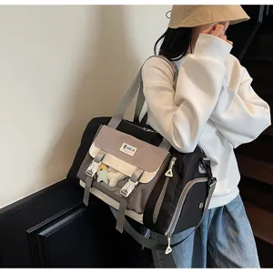 Stylish colorblock travel duffel bag with transparent pocket, large capacity weekender bag.
