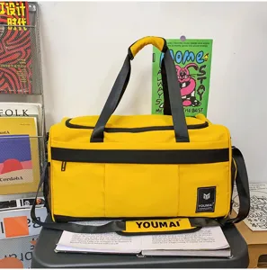Yellow travel duffel bag large capacity gym shoulder bag for travel sports daily use.