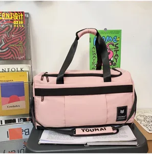 Pink travel duffel bag large capacity sports gym bag with shoulder strap and handles.