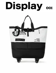 Détail du grand sac de voyage à roulettes, doté de roues durables, de poignées solides et bicolore.