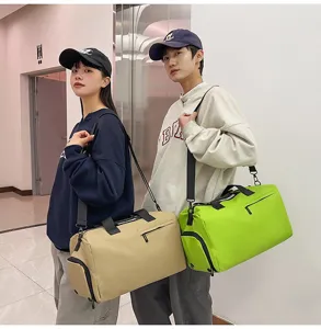 Detailed view of models showcasing large capacity sports duffel bags for travel and gym use.