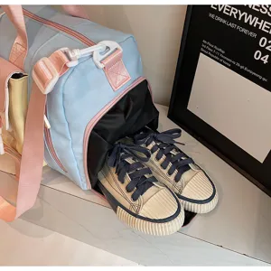 Large capacity color-block travel duffel bag with separate shoe compartment and pink straps.