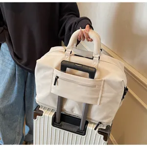 Beige travel duffel bag showing suitcase trolley sleeve, durable storage for short business trips.