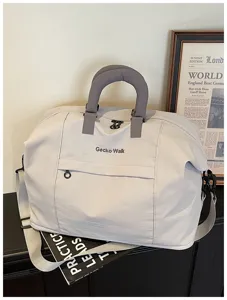 Detailed close-up view of the casual travel duffel bag featuring thick handle and front pocket.